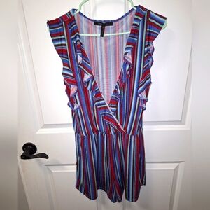 A BCBG Maxazria size small red and blue romper. Polyester/Spandex. It's NWT